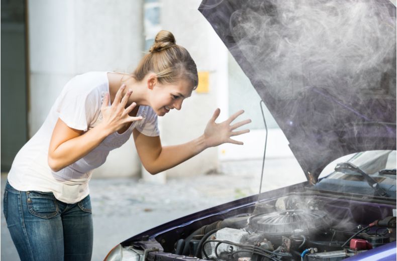 Bubbles appearing in a car's coolant expansion tank, indicating a combustion leak.