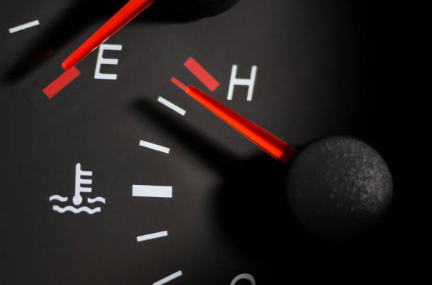 A car's temperature gauge in the red zone, indicating engine overheating.